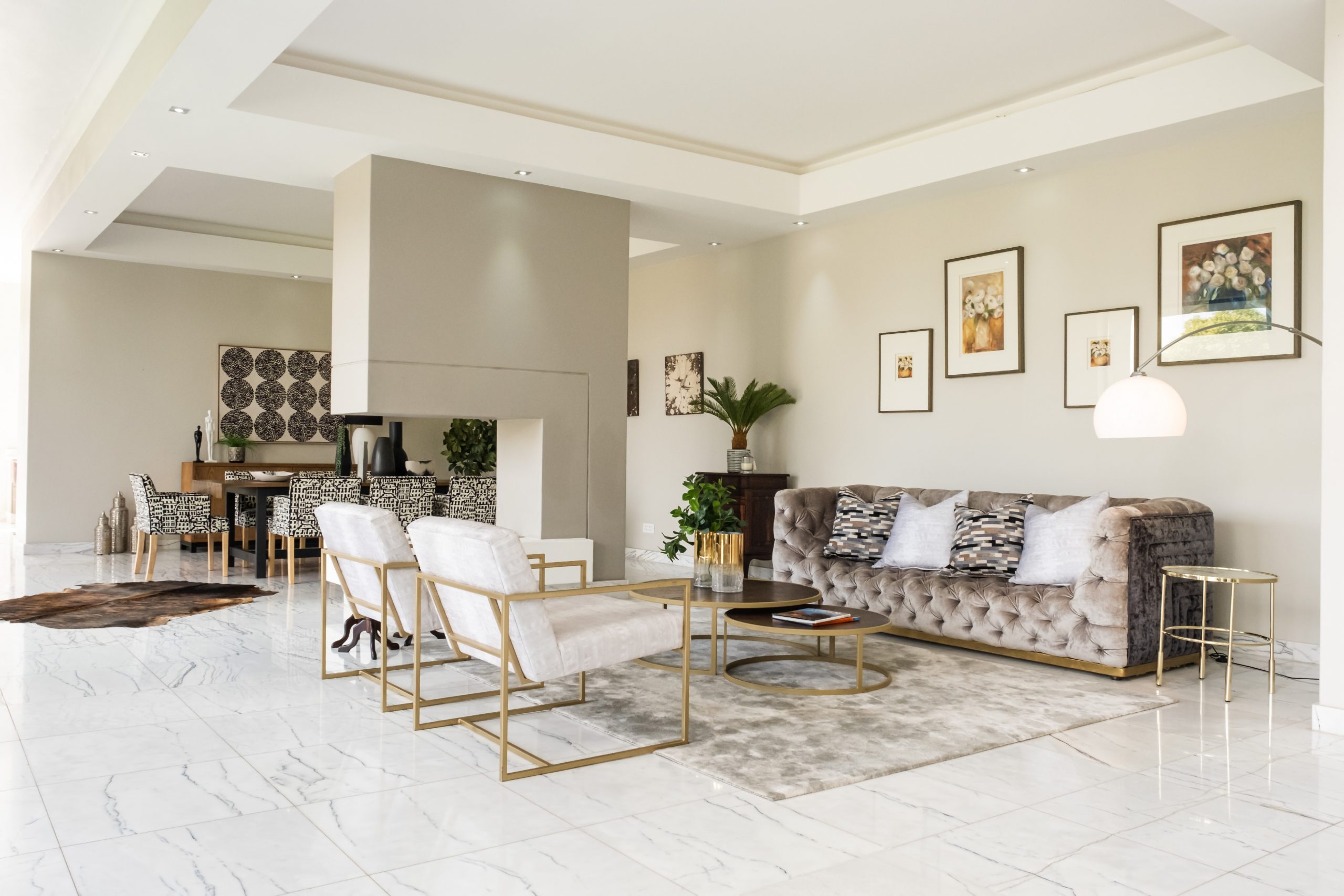 white and gold chairs , brown sofa interior design
